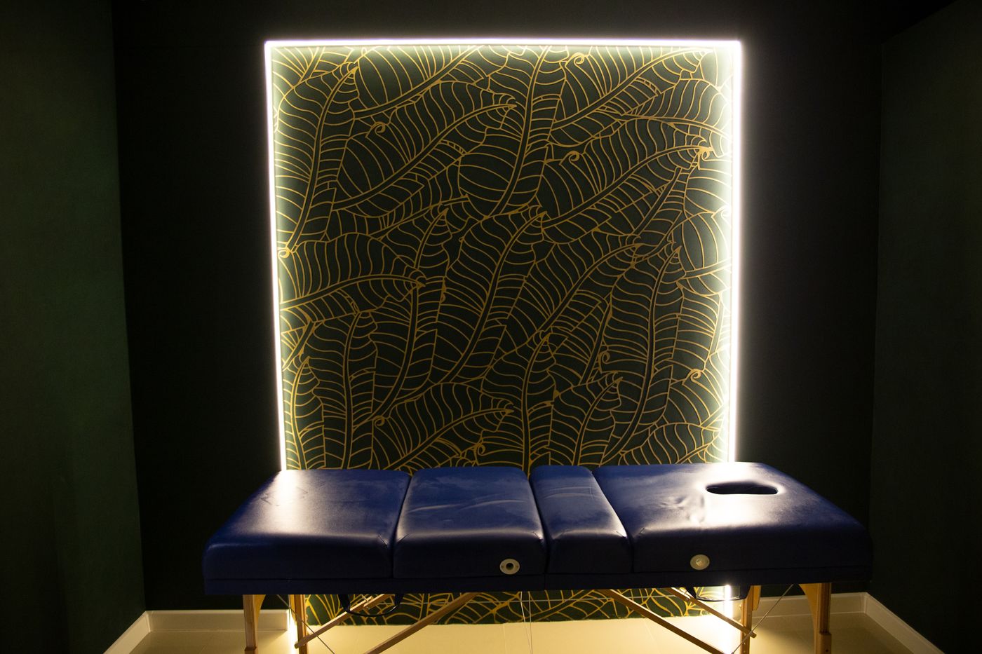 Elegant, softly lit professional massage room